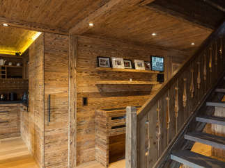 Experience rustic elegance in this stunning home, featuring exquisite wood paneling and flooring throughout.