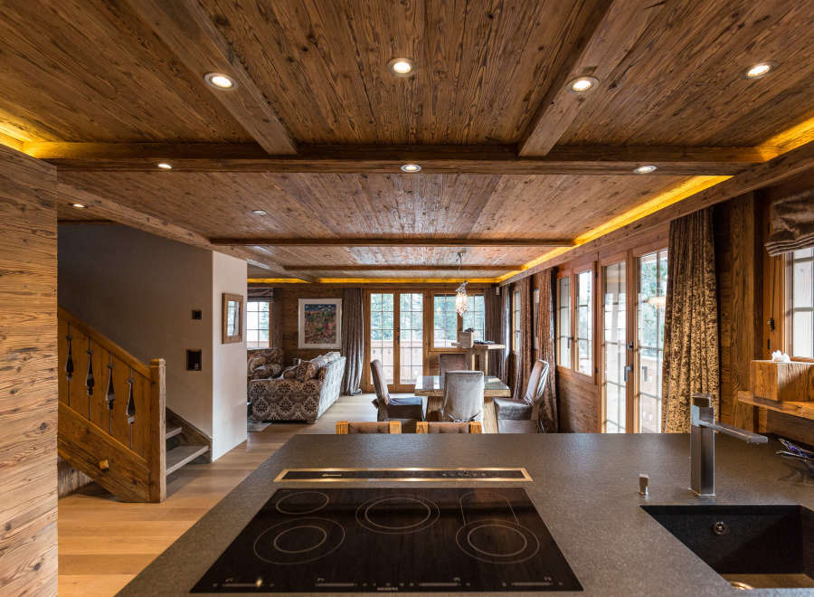 Experience the warmth of this stunning chalet, featuring exquisite wooden ceilings and walls that create a cozy ambiance.