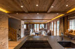Experience the warmth of this stunning chalet, featuring exquisite wooden ceilings and walls that create a cozy ambiance.