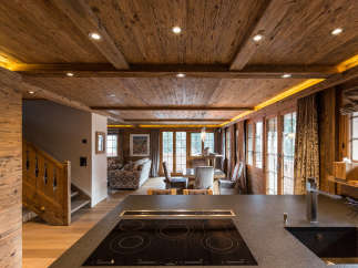 Experience the warmth of this stunning chalet, featuring exquisite wooden ceilings and walls that create a cozy ambiance.