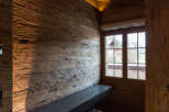 Experience rustic elegance in this stunning room, featuring exquisite wood paneling and a cozy ambiance.