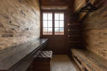 Step into a world of rustic elegance with this stunning wooden closet.
