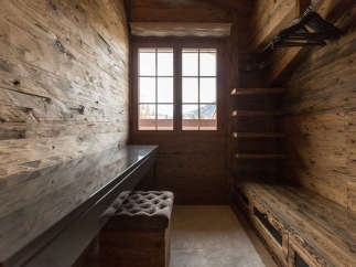 Step into a world of rustic elegance with this stunning wooden closet.