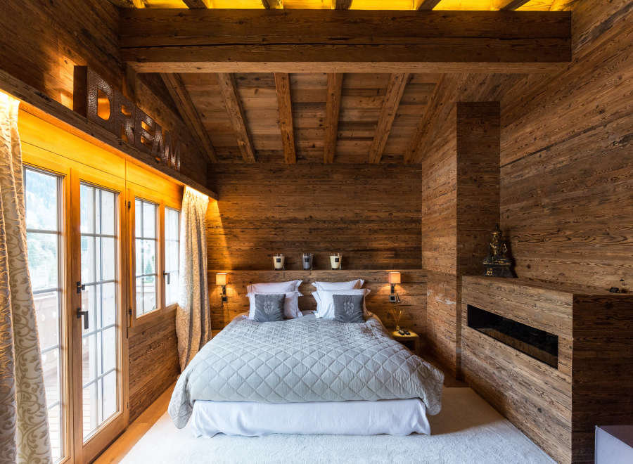 Experience the ultimate in rustic luxury in this stunning bedroom.