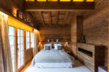 Experience the ultimate in rustic luxury in this stunning bedroom.