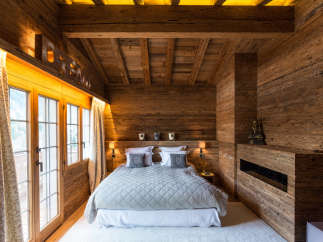 Experience the ultimate in rustic luxury in this stunning bedroom.