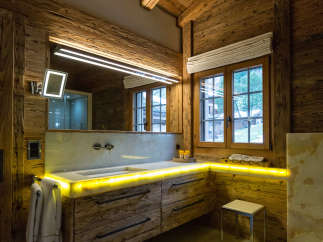 Experience rustic luxury in this stunning bathroom.