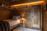 Cozy wooden bedroom with a rustic charm.