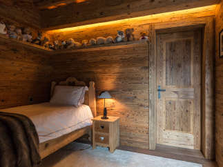 Cozy wooden bedroom with a rustic charm.
