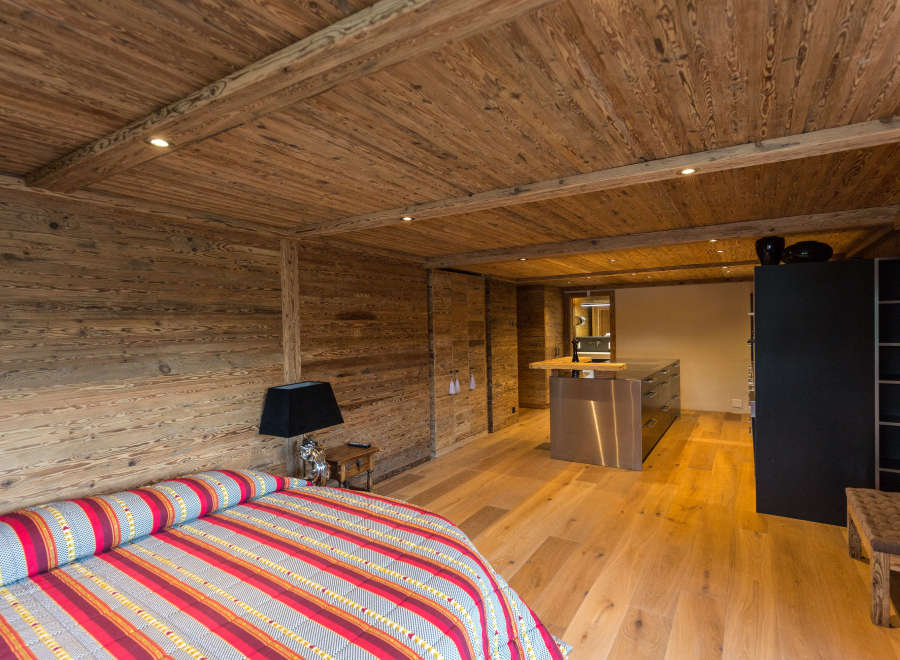 Experience rustic elegance in this stunning bedroom.