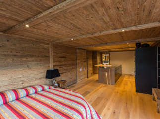 Experience rustic elegance in this stunning bedroom.
