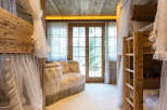 Step into a cozy and inviting bedroom with rustic wooden bunk beds, perfect for a family getaway.
