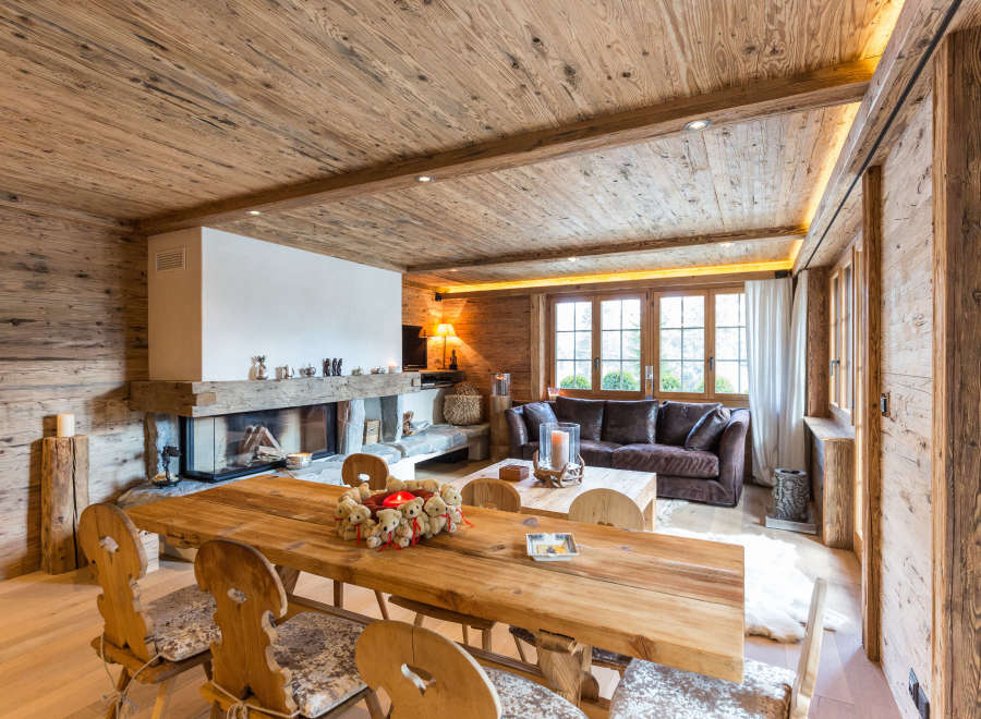 Experience rustic luxury in this stunning chalet, featuring exquisite wooden interiors and a cozy fireplace.