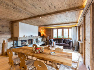 Experience rustic luxury in this stunning chalet, featuring exquisite wooden interiors and a cozy fireplace.