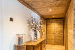 Step into a world of rustic elegance with this stunning hallway.
