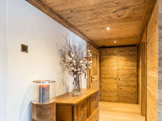 Step into a world of rustic elegance with this stunning hallway.