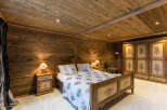 Experience rustic charm in this cozy bedroom.
