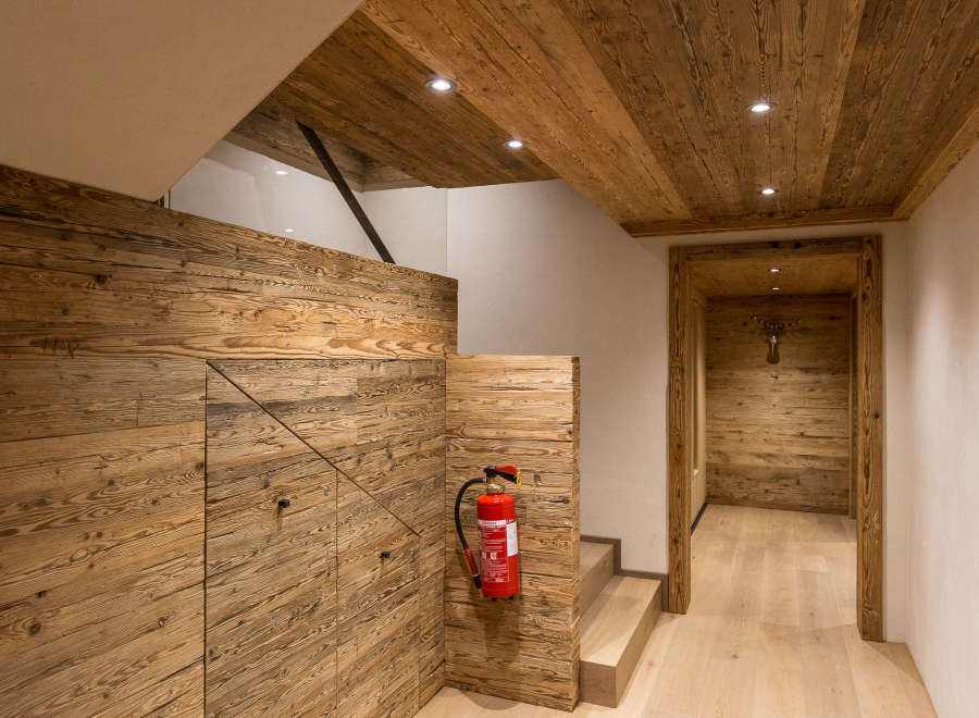 This stunning interior showcases a harmonious blend of natural wood elements, creating a warm and inviting atmosphere.
