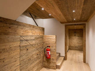 This stunning interior showcases a harmonious blend of natural wood elements, creating a warm and inviting atmosphere.