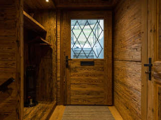 Step into rustic elegance with this stunning wooden entryway.