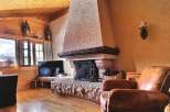 Cozy living room with a rustic fireplace, perfect for relaxing evenings.