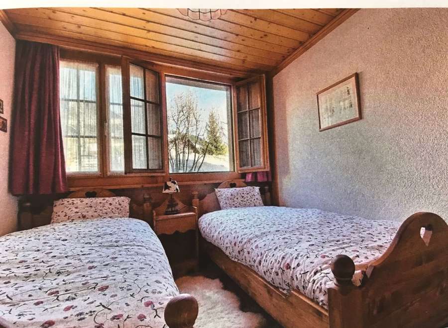 Cozy bedroom with two single beds, perfect for a relaxing getaway.