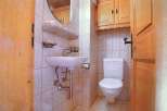 This charming bathroom features a classic design with a touch of rustic elegance.