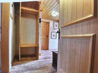 Step into a charming space with rustic wooden floors and a warm, inviting atmosphere.