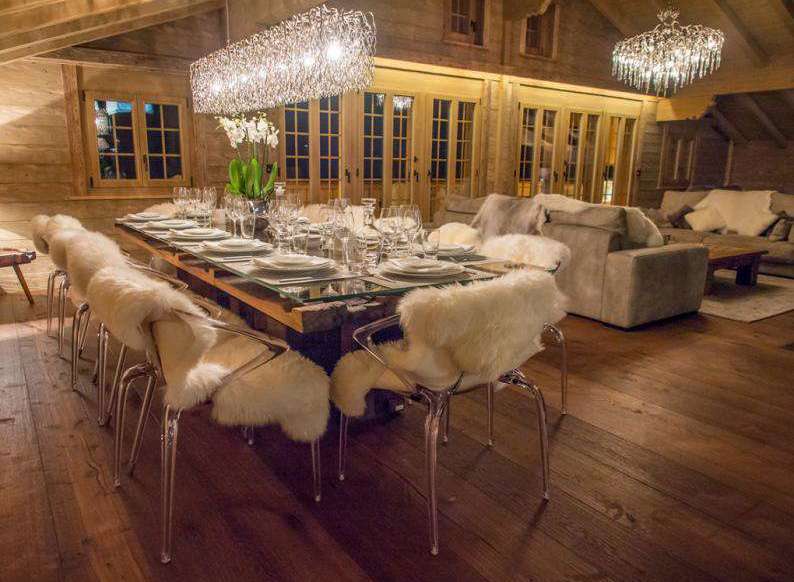 Experience luxury in this stunning chalet, featuring a beautifully set dining table perfect for hosting.