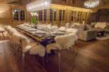 Experience luxury in this stunning chalet, featuring a beautifully set dining table perfect for hosting.