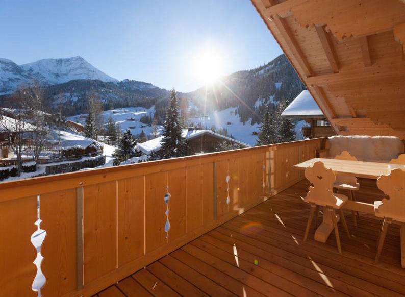 Enjoy breathtaking mountain views from this cozy balcony.