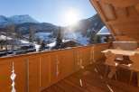 Enjoy breathtaking mountain views from this cozy balcony.