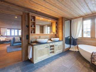 Experience rustic luxury in this stunning bathroom.