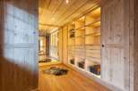 Step into luxury with this stunning wooden walk-in closet.