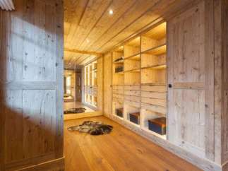 Step into luxury with this stunning wooden walk-in closet.