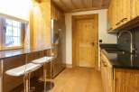 This stunning kitchen boasts a rustic charm with its wooden cabinetry and flooring, creating a warm and inviting atmosphere.