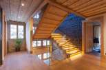 Step into luxury with this stunning property featuring a beautifully crafted wooden staircase.