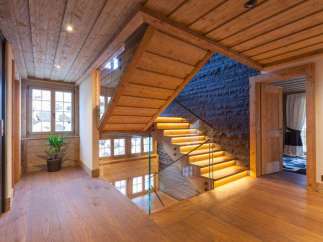 Step into luxury with this stunning property featuring a beautifully crafted wooden staircase.