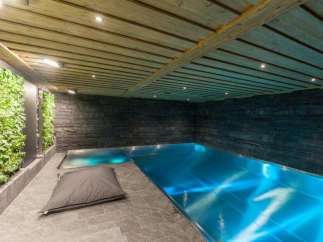 Indulge in luxury with this stunning indoor pool.