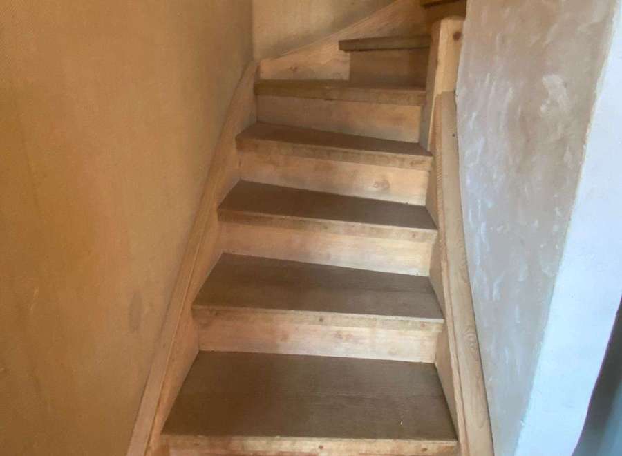 Discover the charm of this property with its inviting staircase.