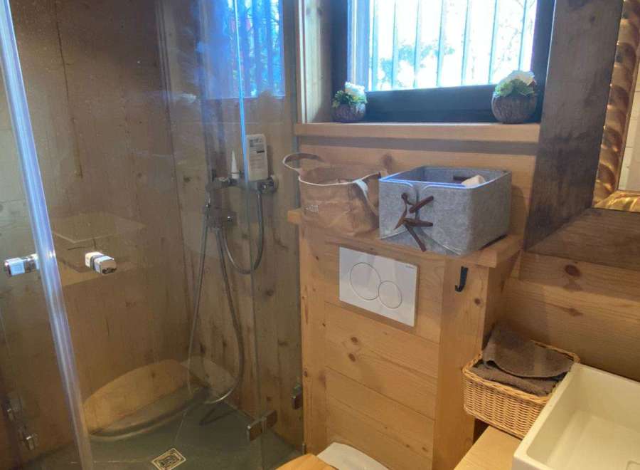 Experience rustic charm in this cozy bathroom.