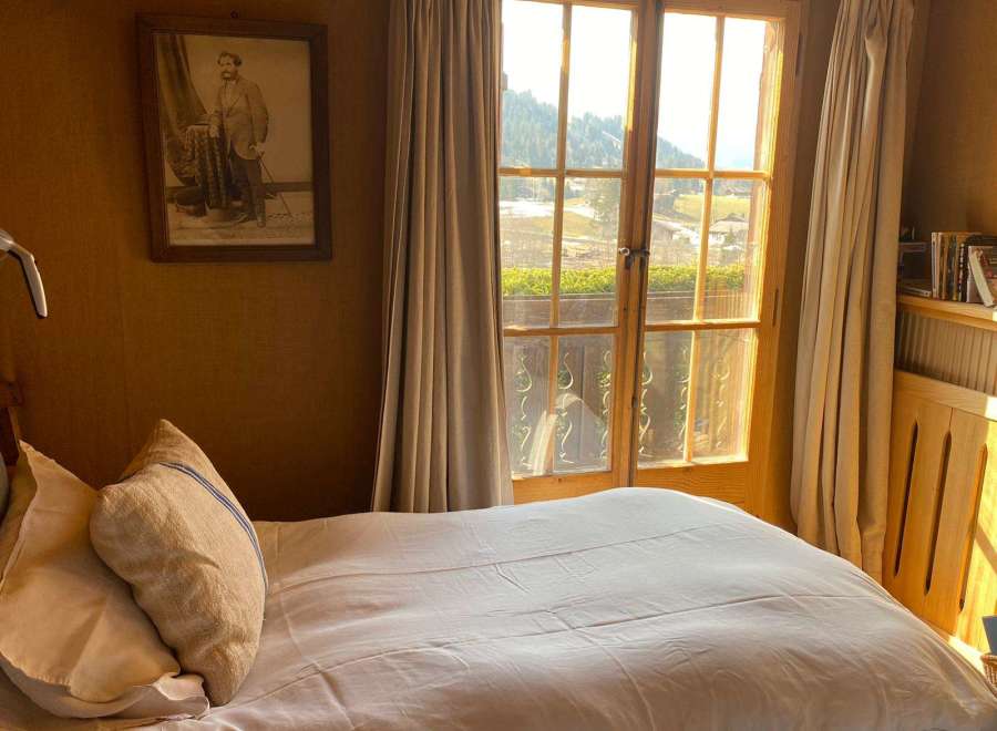 Cozy bedroom with a stunning mountain view.
