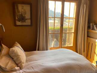 Cozy bedroom with a stunning mountain view.