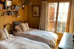 Cozy bedroom with twin beds, perfect for a relaxing getaway.