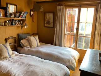 Cozy bedroom with twin beds, perfect for a relaxing getaway.