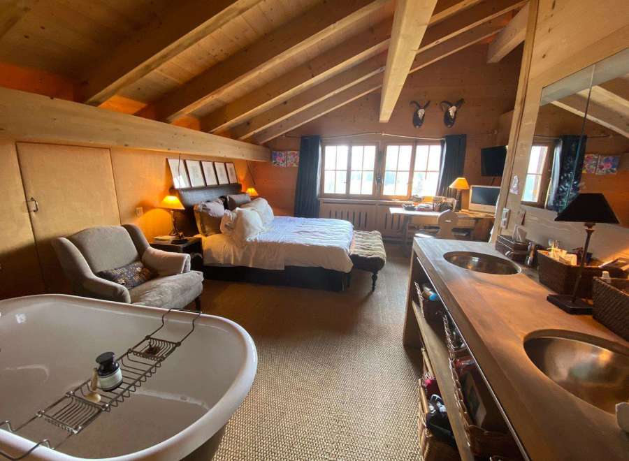 Experience rustic luxury in this stunning bedroom.
