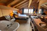 Experience rustic luxury in this stunning bedroom.
