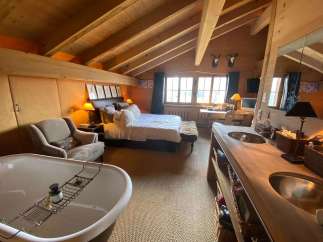 Experience rustic luxury in this stunning bedroom.