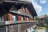 Discover the charm of this traditional Swiss chalet, featuring a beautifully crafted wooden facade and intricate balcony details.