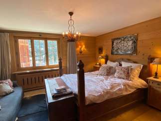 Experience rustic charm in this cozy bedroom.